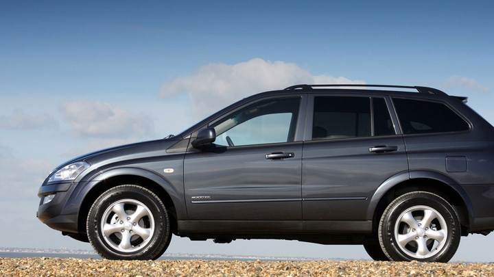 SsangYong Kyron 2008 Side Pose In Black Near Sea